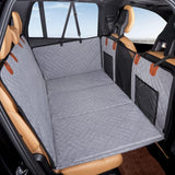 Gray quilted pet back seat extender with mesh storage pockets