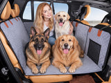 Black quilted pet back seat extender installed across a car back seat