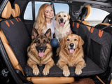 Black quilted pet back seat extender installed across a car back seat