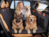 Black quilted pet back seat extender installed across a car back seat